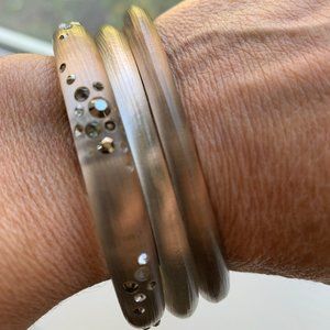 set of smoky colored lucite bangles